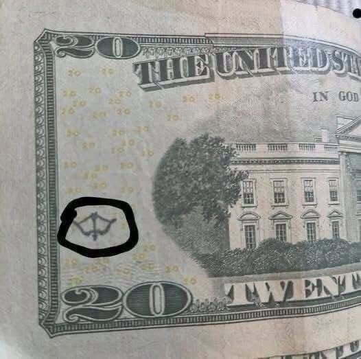 Why Does My $20 Bill Have a Tiny Bow-and-Arrow-Like Symbol on It? Here’s What That Mysterious Mark Could Actually Mean