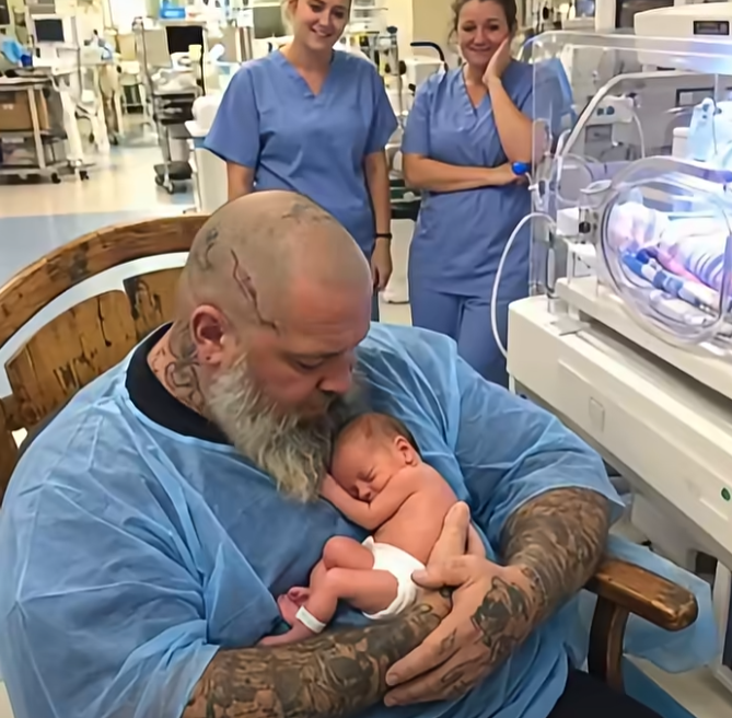 The NICU Fell Quiet When a Giant Tattooed Biker Asked to Hold the Baby No One Had Visited—But After Twelve Hours in the Same Chair, the Nurses Discovered the Touching Secret Behind the Tattoo on His Wrist